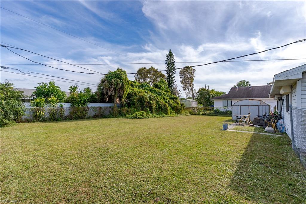 2100 55th Terrace Southwest Naples, FL 34116 - Photo 10 of 33 a swimming pool with outdoor seating and yard
