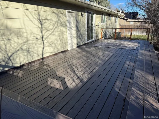 a view of outdoor space with wooden floor