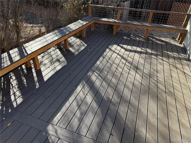 a view of balcony with wooden floor
