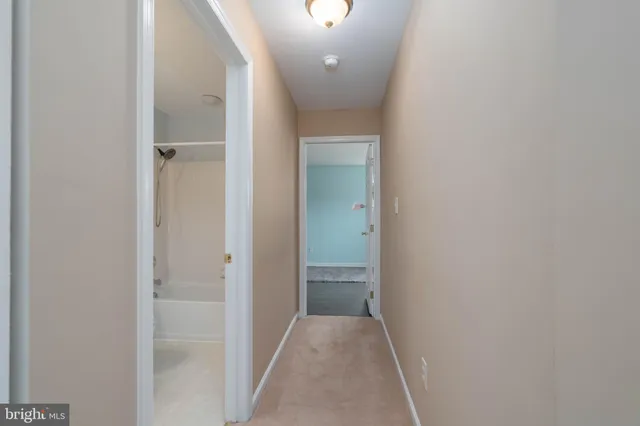 a view of hallway with sink