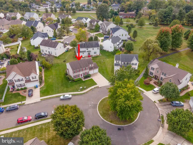 an aerial view of a house with yard swimming pool and outdoor seating