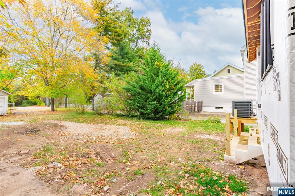 307 Hillside Avenue Nutley, NJ 07110 - Photo 18 of 19 a view of backyard of house with green space