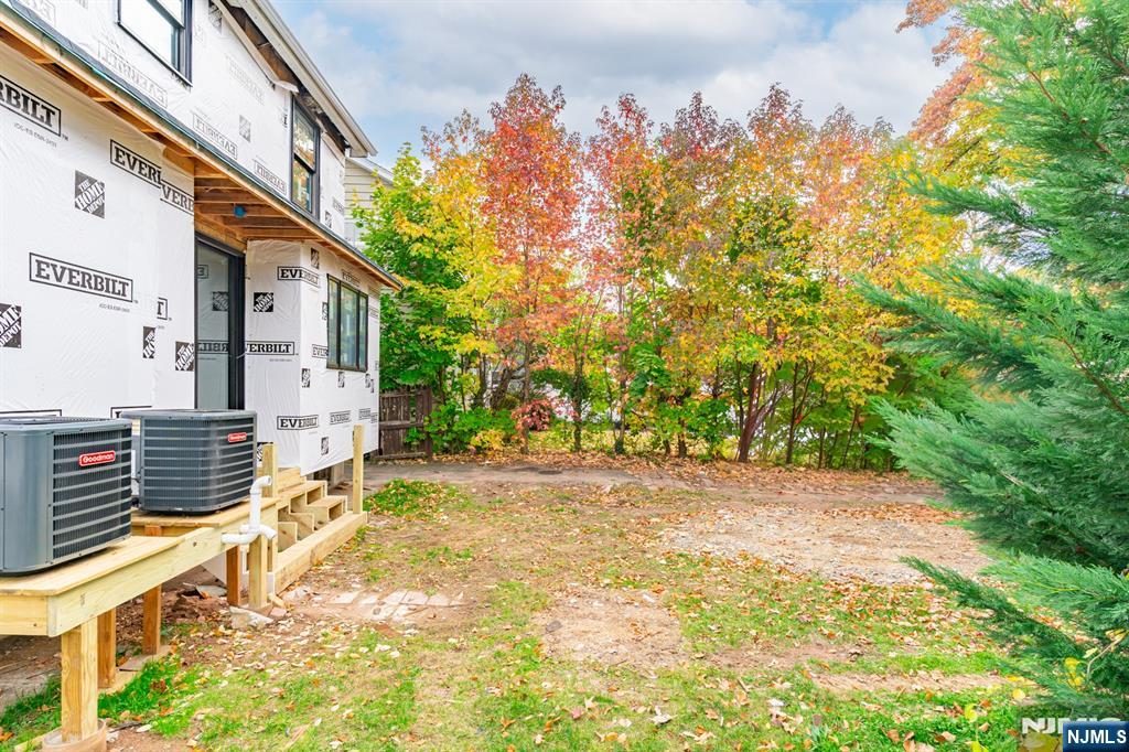 307 Hillside Avenue Nutley, NJ 07110 - Photo 19 of 19 a view of a pathway with a house in the background