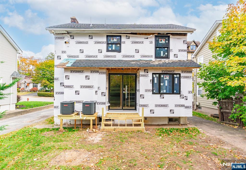 307 Hillside Avenue Nutley, NJ 07110 - Photo 4 of 19 front view of house with a yard glass top table and chairs