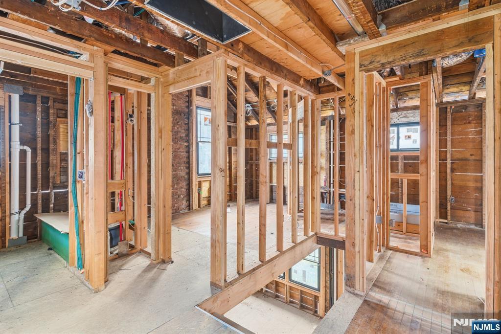 307 Hillside Avenue Nutley, NJ 07110 - Photo 10 of 19 a view of a hallway with wooden walls and windows