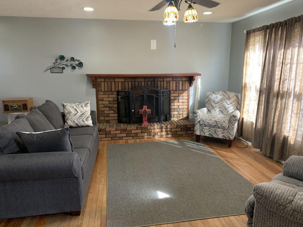 5015 Highcrest Road Rockford, IL 61107 - Photo 2 of 12 a living room with furniture and a fireplace