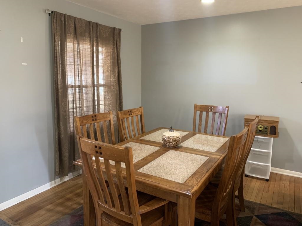 5015 Highcrest Road Rockford, IL 61107 - Photo 4 of 12 a view of a dining room with furniture window and wooden floor