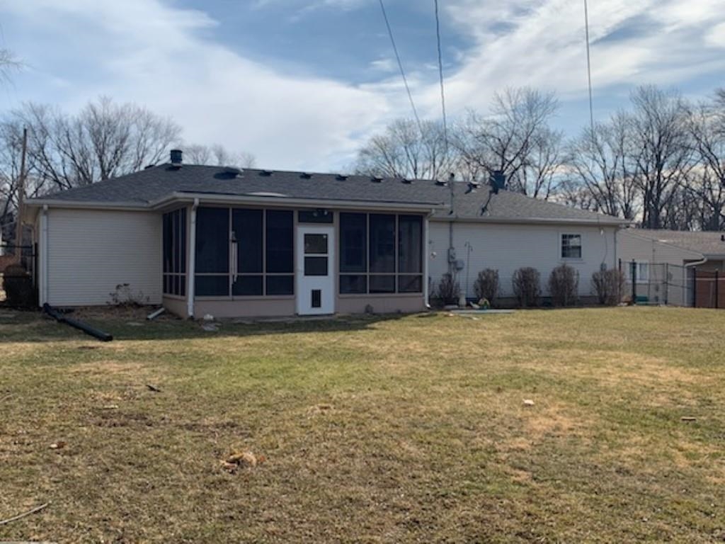 5015 Highcrest Road Rockford, IL 61107 - Photo 10 of 12 a view of a house with a backyard and plants