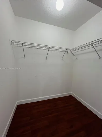 a view of a room with racks on the wall