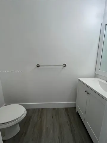 a bathroom with a toilet and a sink