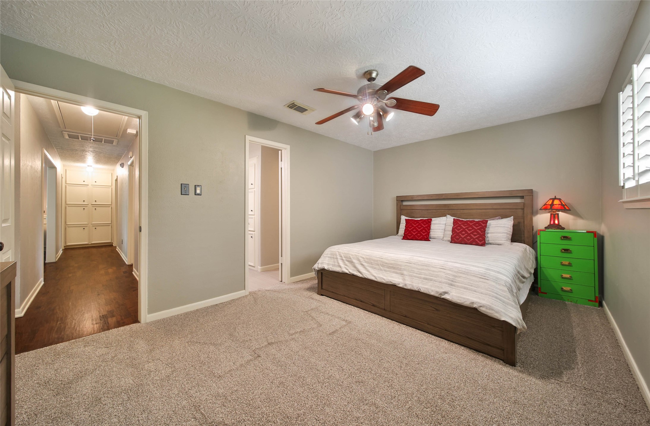 17007 Windrow Drive Spring, TX 77379 - Photo 29 of 46 a bedroom with a large bed and a chandelier