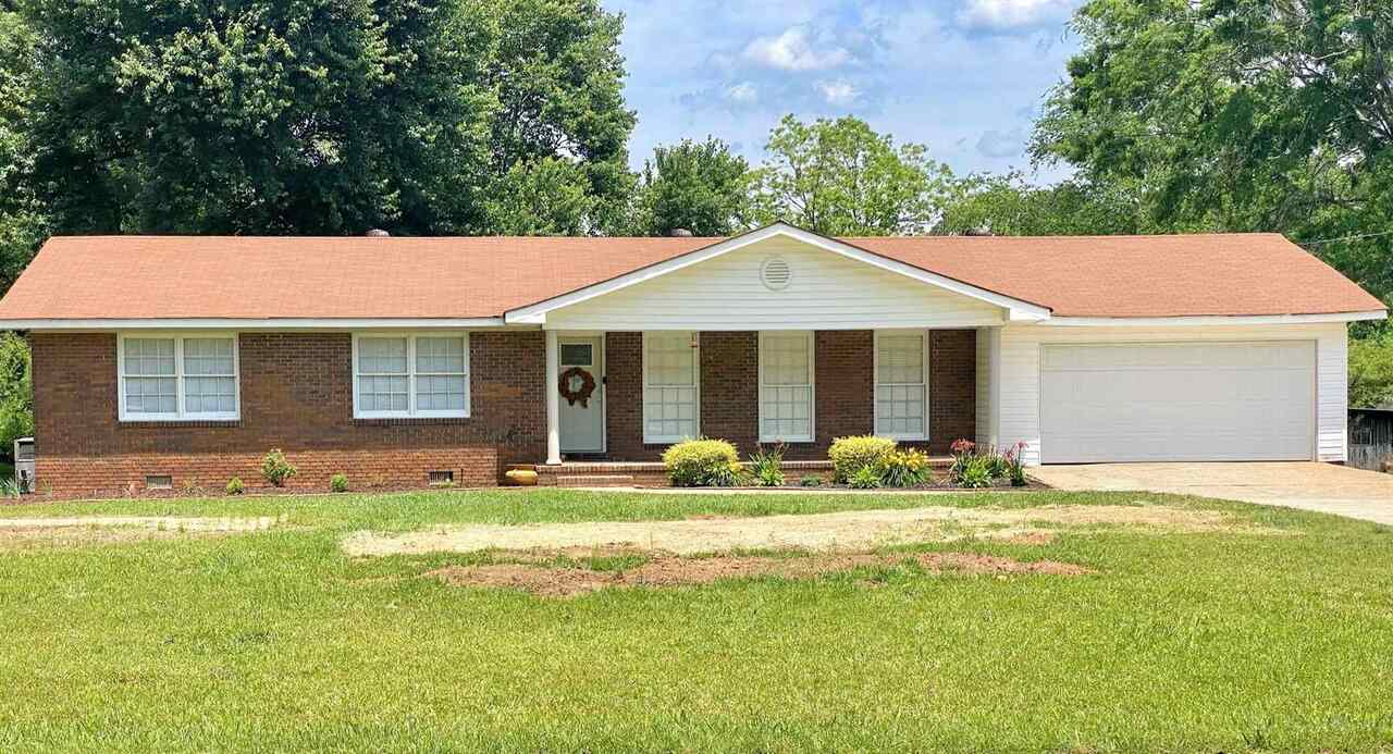 169 Barrett Road Bowdon, GA 30108 - Photo 1 of 1 a front view of a house with a garden and porch