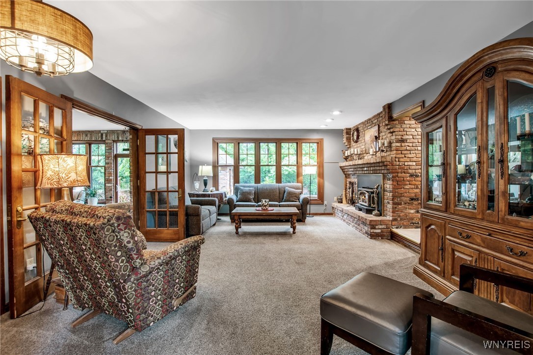 393 Glengrove Road Porter, NY 14174 - Photo 15 of 50 Living room with wood burning fireplace