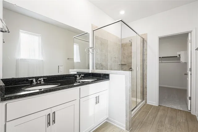 an empty room with window and ceiling fan