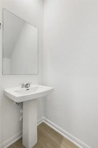 a kitchen with a sink and a refrigerator