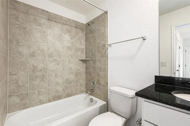 a view of an empty room and a window