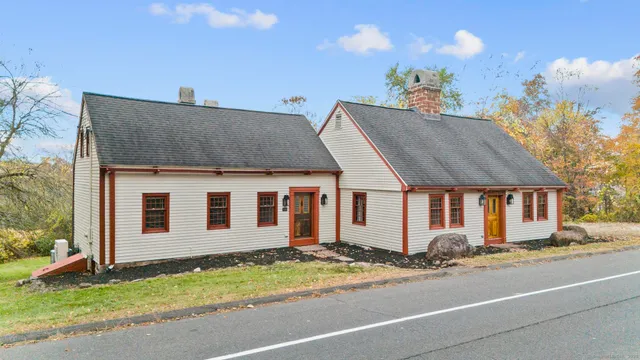 a aerial view of a house with a yard