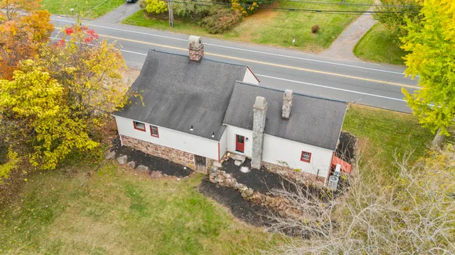 a view of a street with a building in the background