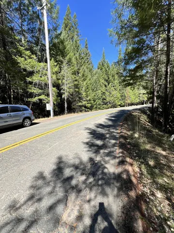 a view of a road with a building in the background