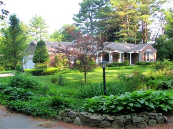 28 Fox Run Road Topsfield, MA 01983 - Photo 1 of 18 a front view of a house with a yard and trees