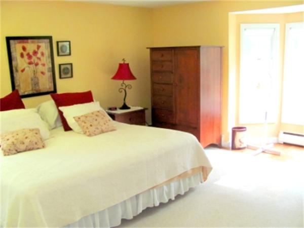 28 Fox Run Road Topsfield, MA 01983 - Photo 15 of 18 a bedroom with a bed and a painting on the wall