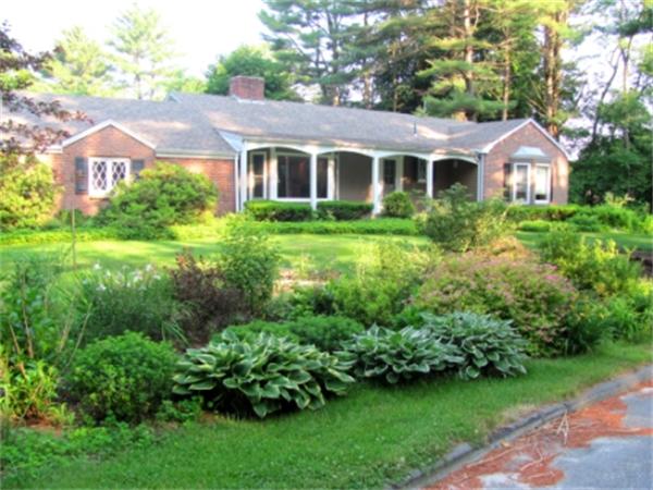 28 Fox Run Road Topsfield, MA 01983 - Photo 2 of 18 a front view of a house with a yard and green space