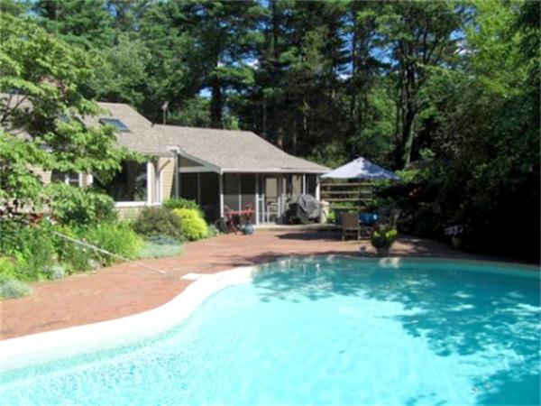 28 Fox Run Road Topsfield, MA 01983 - Photo 6 of 18 a view of a patio with a table and chairs under an umbrella