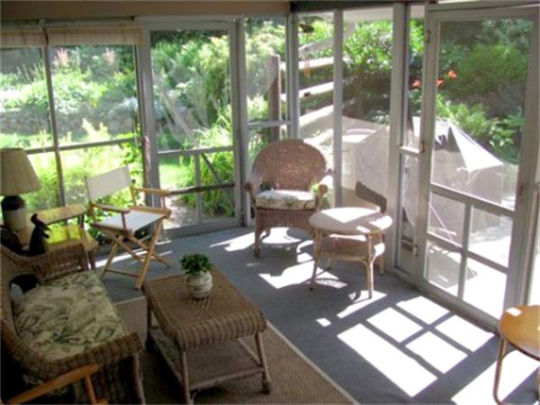 28 Fox Run Road Topsfield, MA 01983 - Photo 8 of 18 a living room with patio furniture and a floor to ceiling window