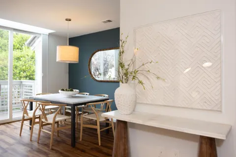 a view of a dining room with furniture and window