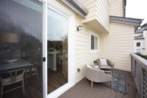 a view of a house with outdoor seating