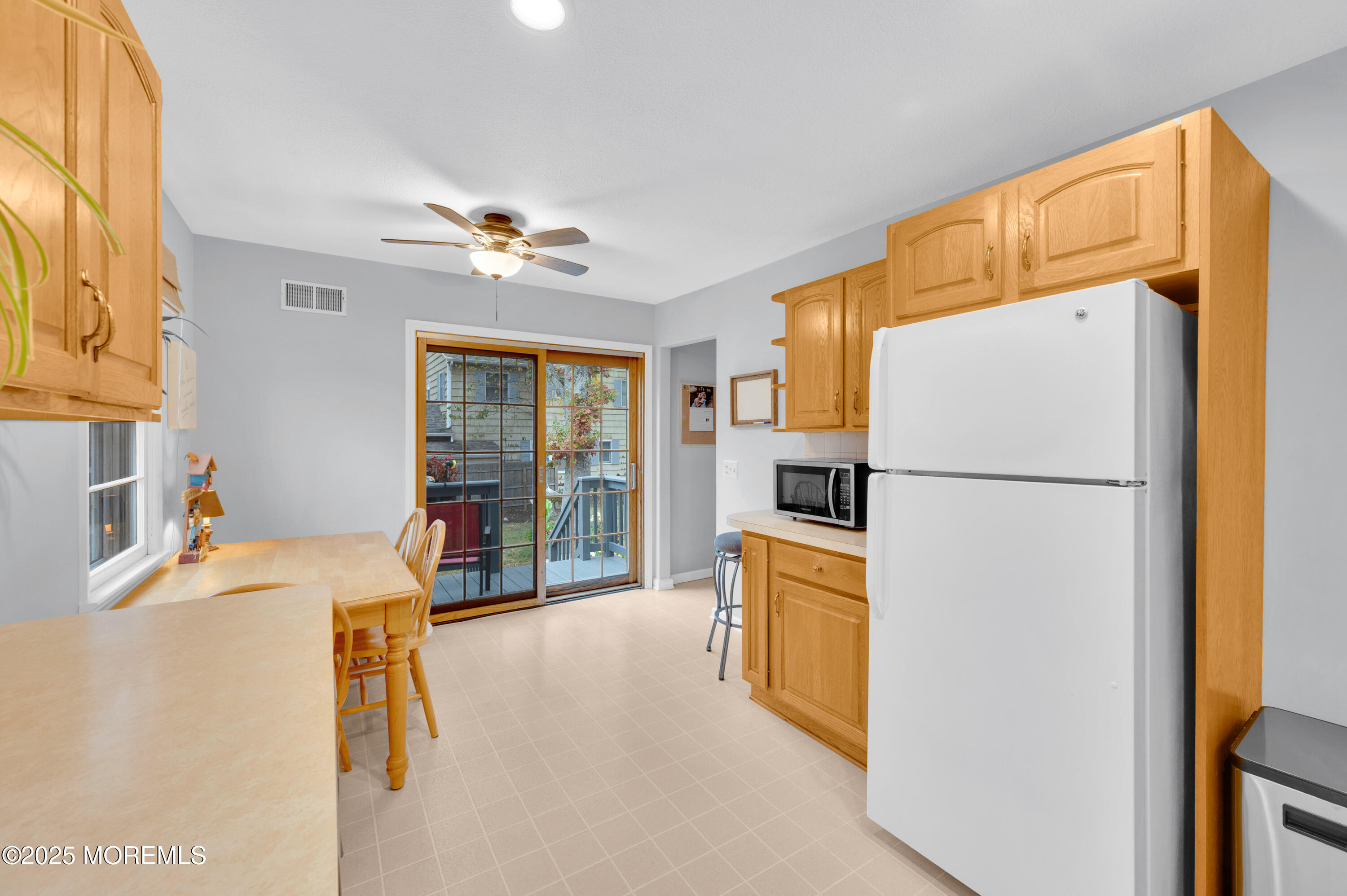 203 Lenape Trail Brielle, NJ 08730 - Photo 11 of 29 a bed room with a bed furniture and a refrigerator