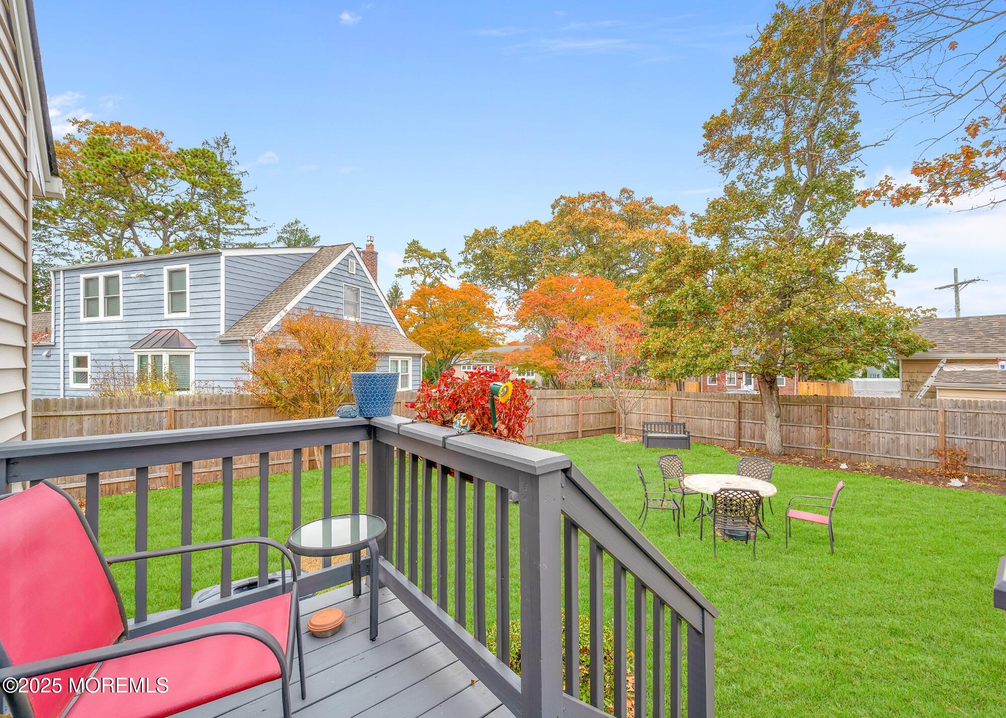 203 Lenape Trail Brielle, NJ 08730 - Photo 13 of 29 a view of a wooden deck and a backyard