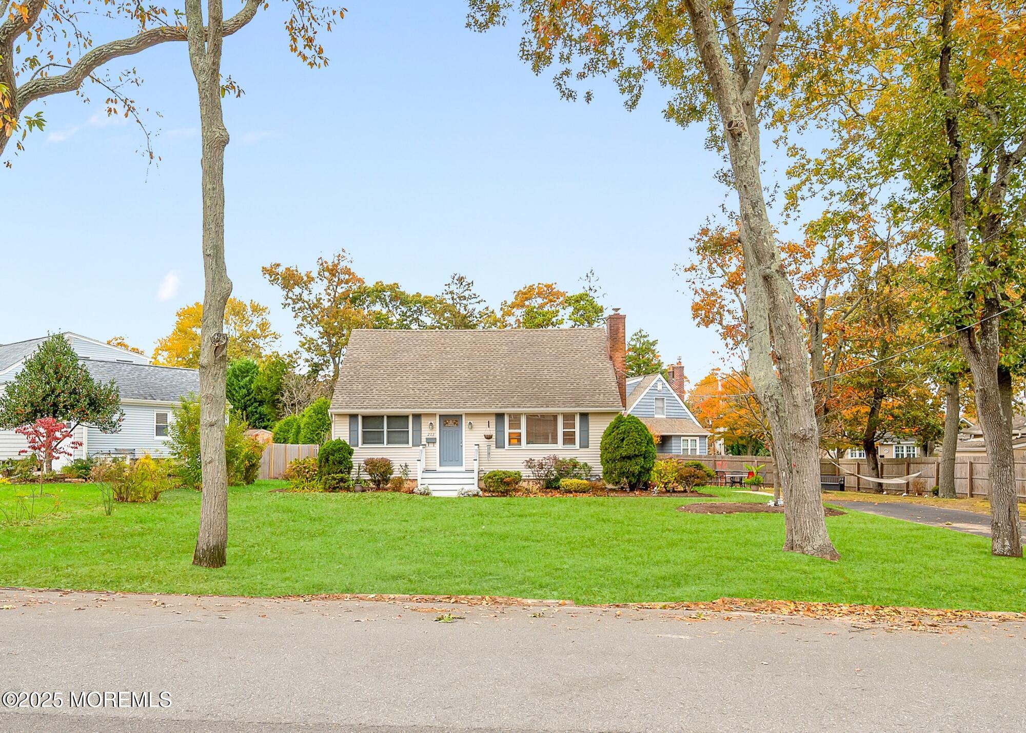 203 Lenape Trail Brielle, NJ 08730 - Photo 2 of 29 a front view of house with yard and green space