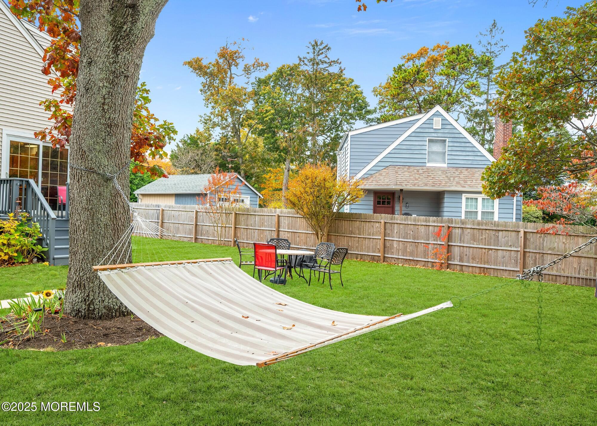 203 Lenape Trail Brielle, NJ 08730 - Photo 24 of 29 a view of a backyard with a garden