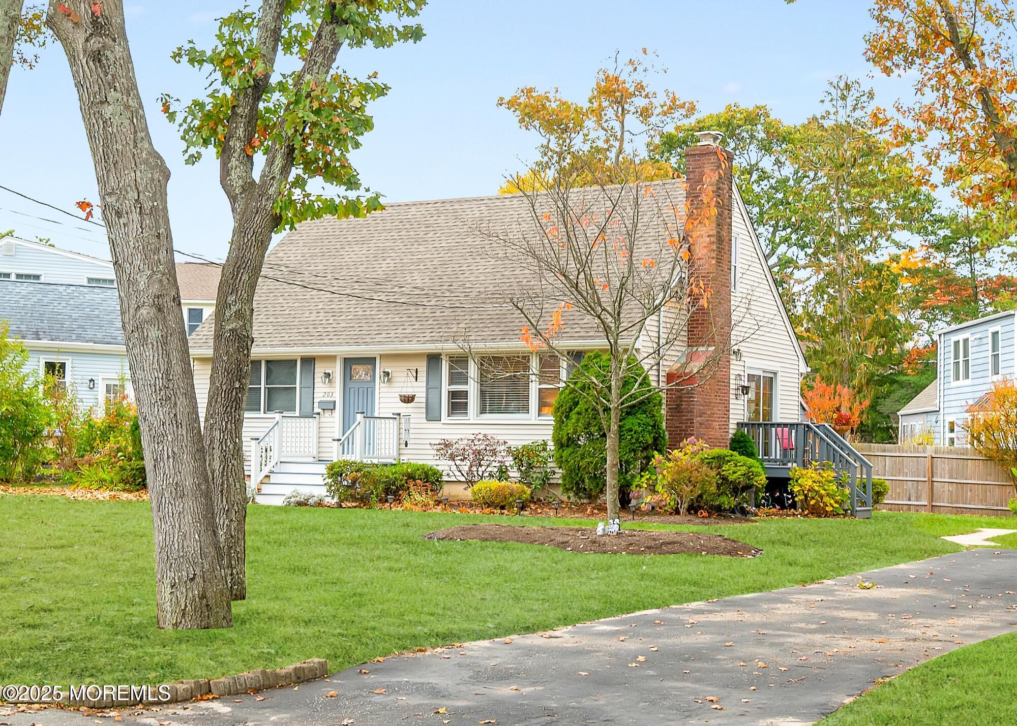 203 Lenape Trail Brielle, NJ 08730 - Photo 4 of 29 a front view of house with yard and green space