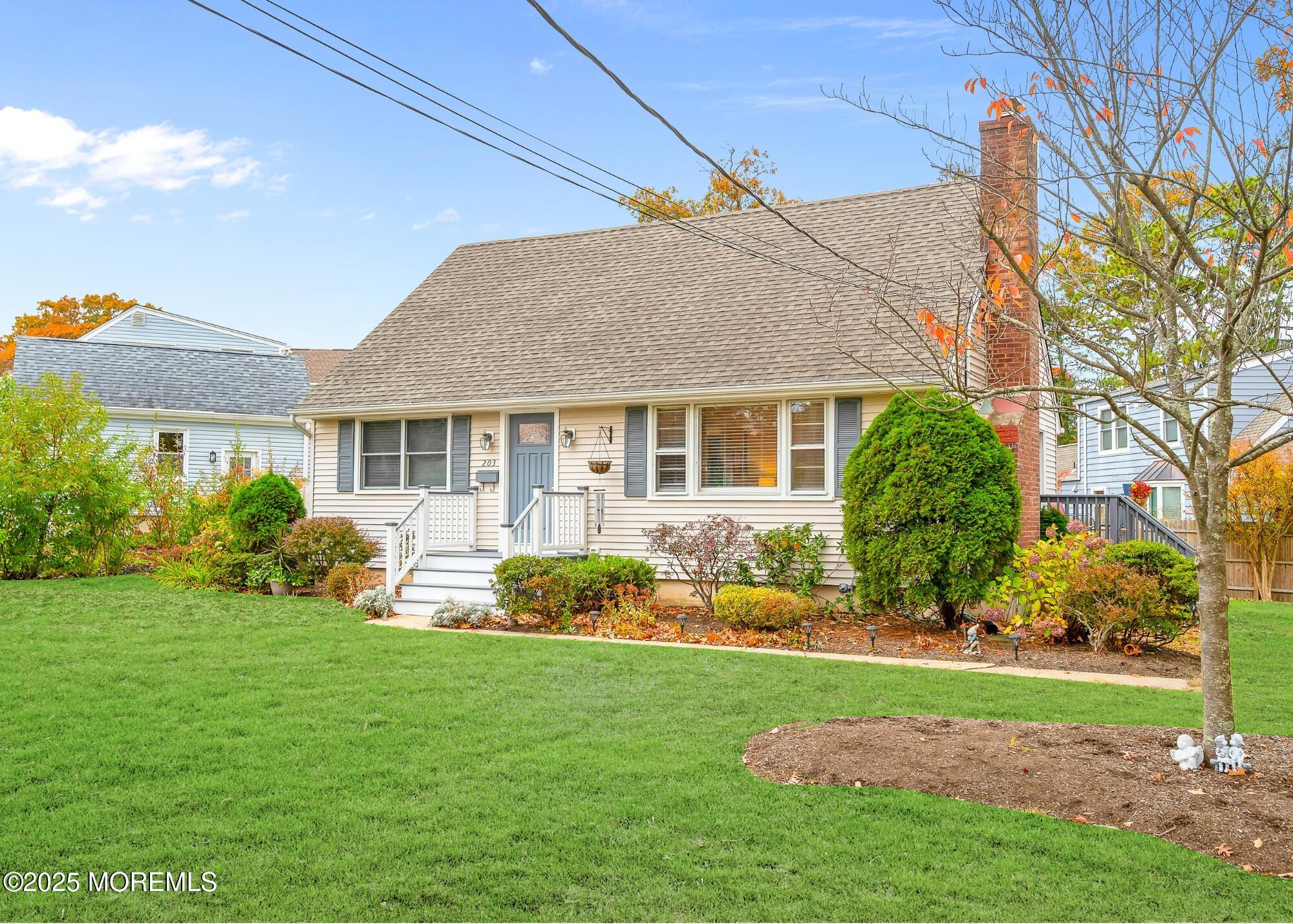 203 Lenape Trail Brielle, NJ 08730 - Photo 5 of 29 a front view of a house with a yard
