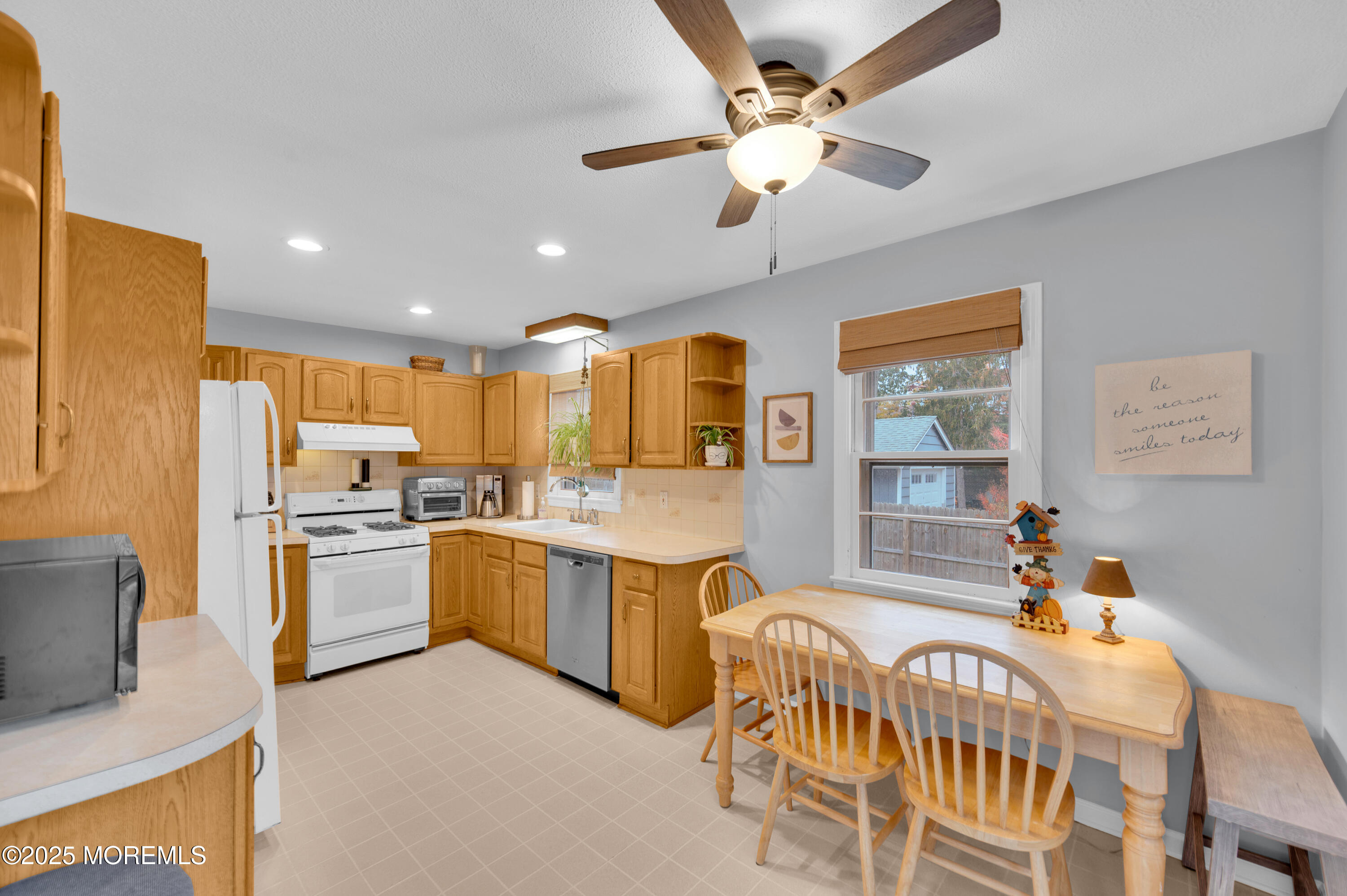 203 Lenape Trail Brielle, NJ 08730 - Photo 10 of 29 a kitchen with stainless steel appliances kitchen island granite countertop a sink and cabinets
