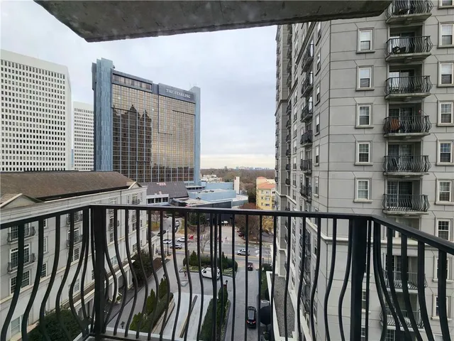 a view of a balcony with city view