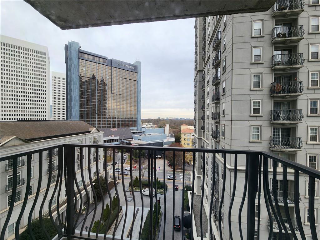 a view of a balcony with city view