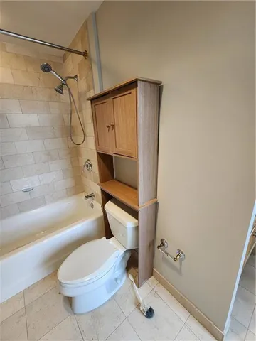 an empty room with windows and entrance