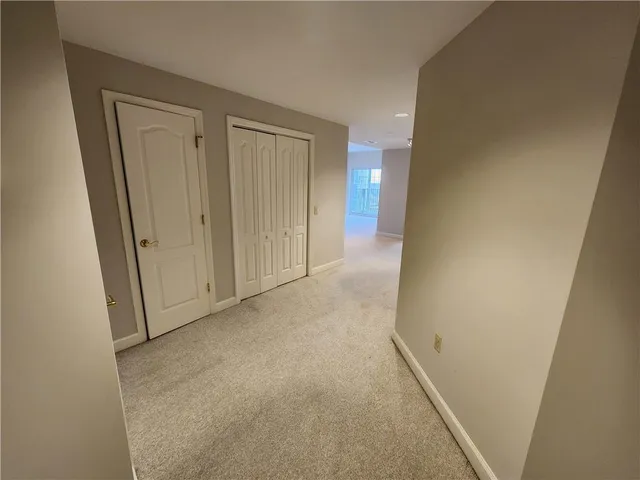 a view of a hallway with an empty room