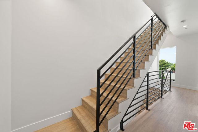 a view of stairs and with wooden floor