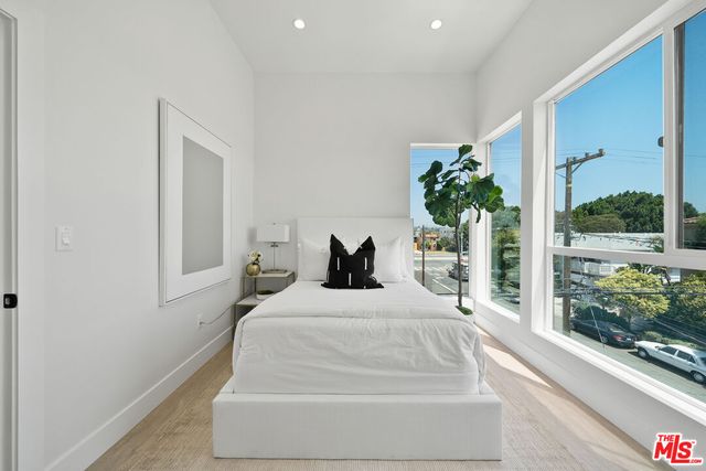 a large white bed in a room
