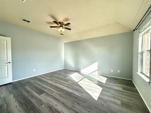 a bathroom with a bathtub sink and mirror