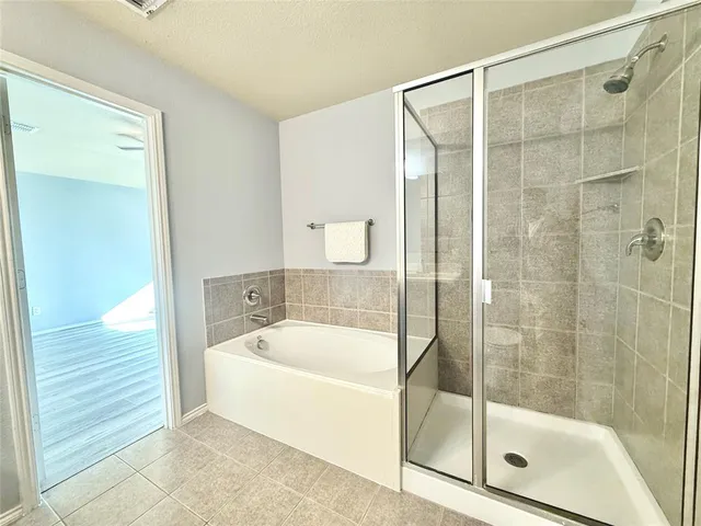 a bathroom with a toilet sink double vanity and mirror