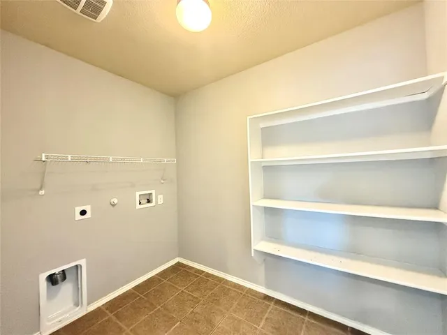a view of a room with wooden walls