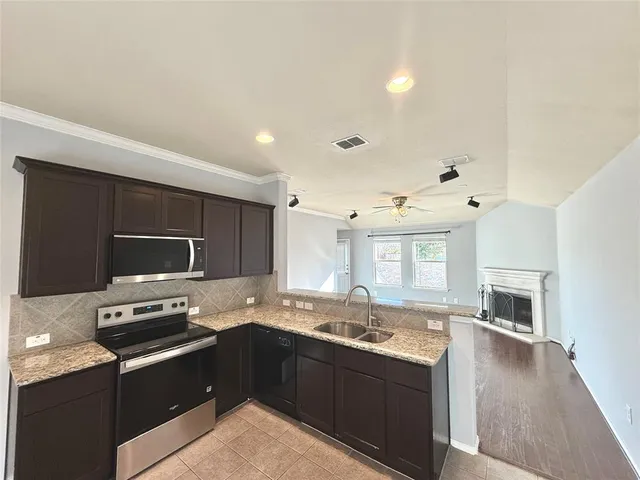 a kitchen with a stove and a microwave