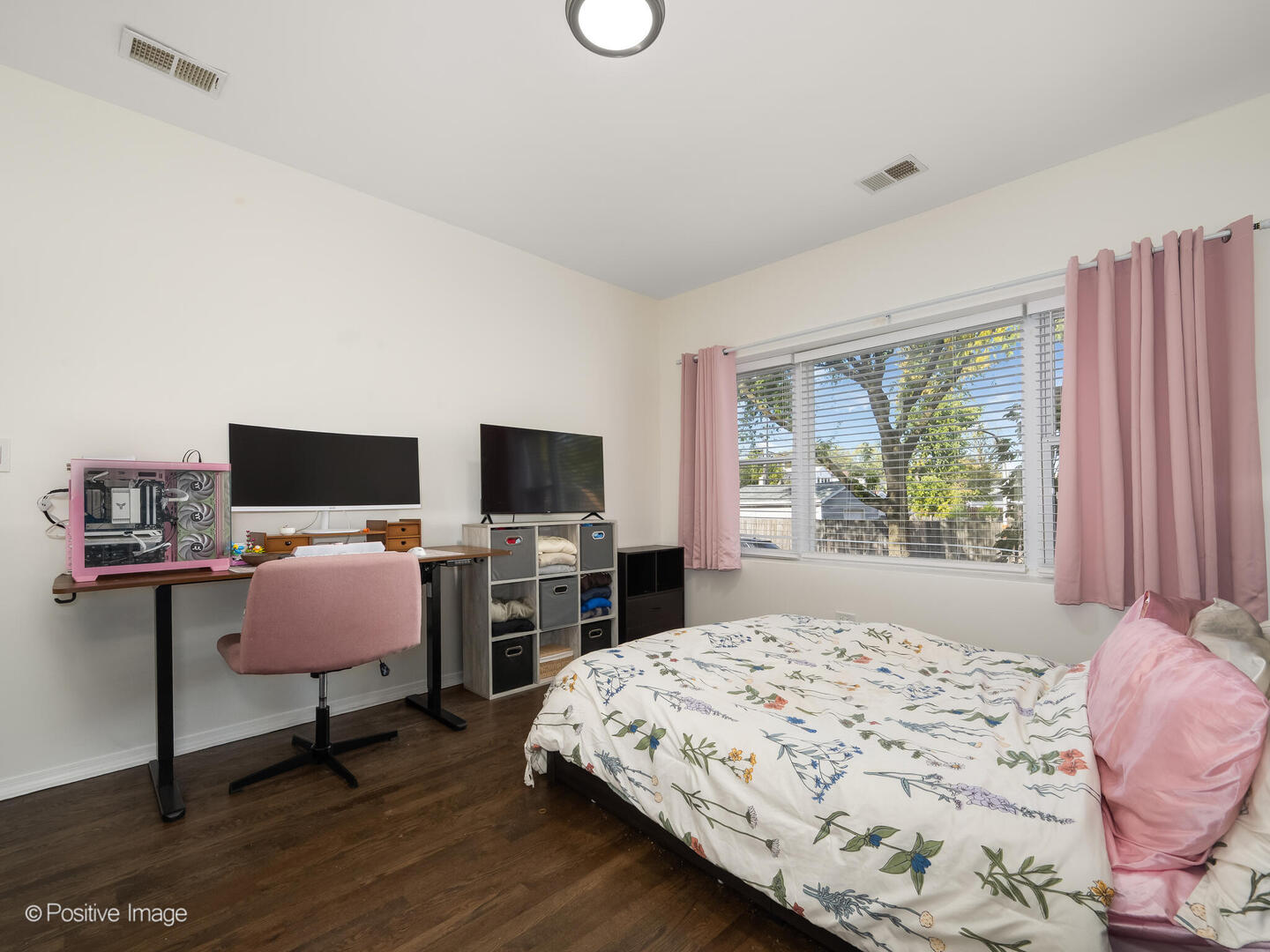 4101 West Iowa Street, Unit 6 Chicago, IL 60651 - Photo 14 of 16 a bedroom with a bed and a flat screen tv