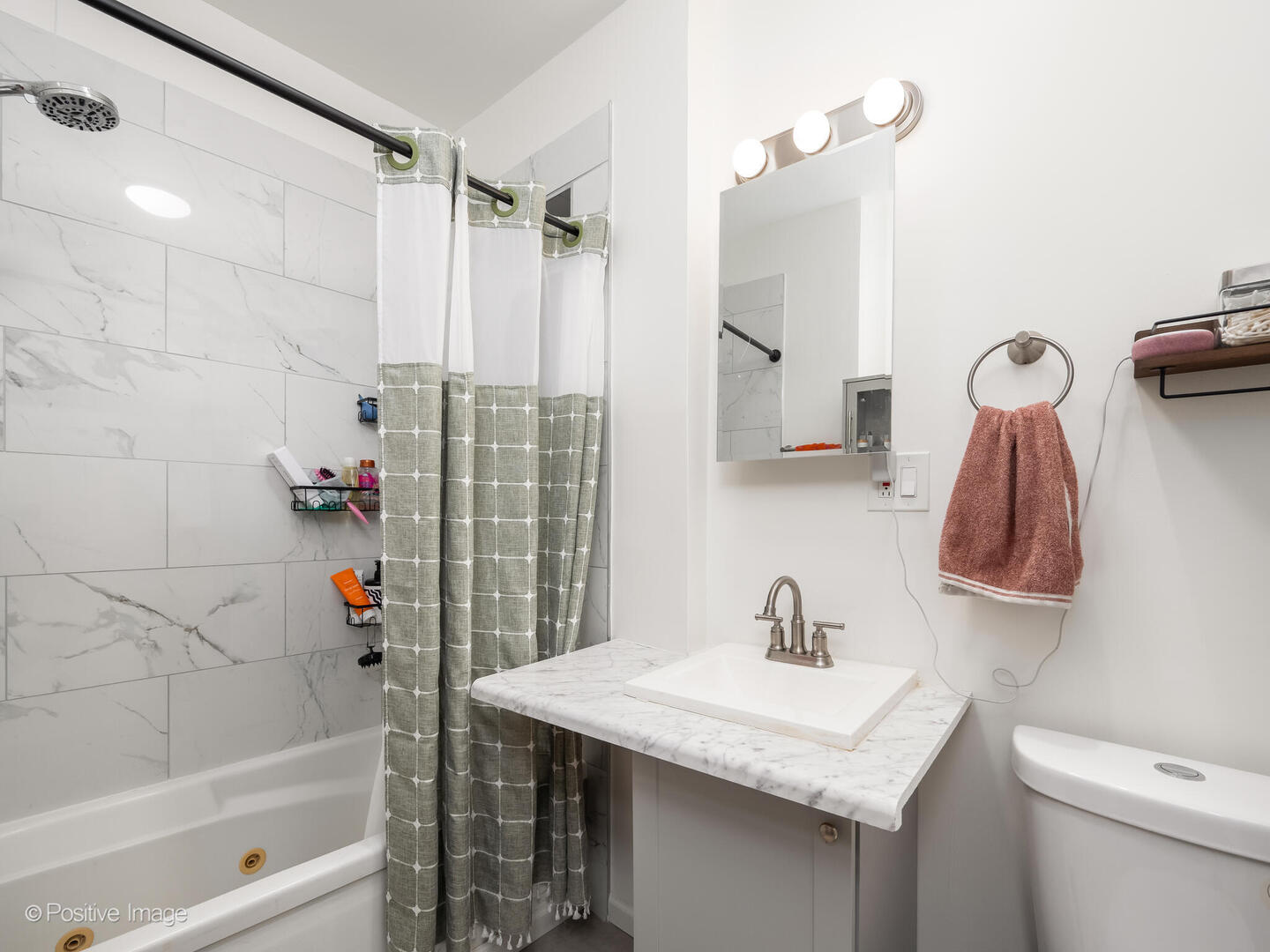4101 West Iowa Street, Unit 6 Chicago, IL 60651 - Photo 15 of 16 a bathroom with a sink a toilet and shower