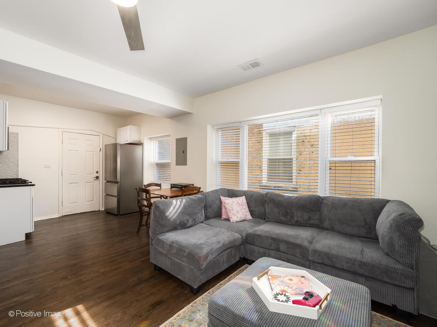 4101 West Iowa Street, Unit 6 Chicago, IL 60651 - Photo 8 of 16 a living room with furniture and a large window